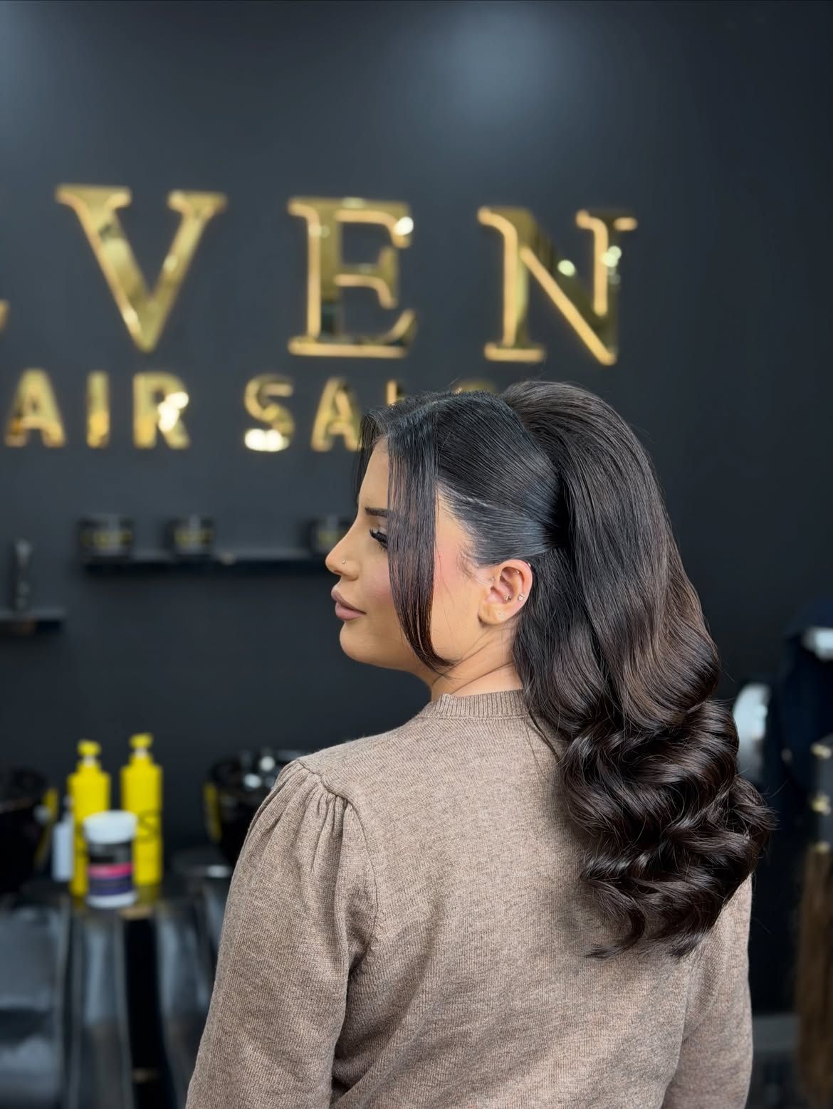 Hollywood waves styled at Even Hair Salon in front of the gold sign